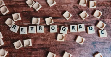 brown wooden letter blocks on brown wooden table